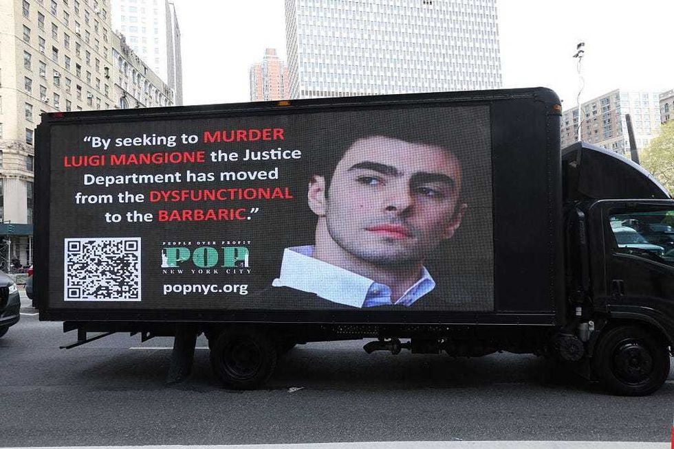 A truck with a video screen outside Manhattan Federal Court on April 25, 2025 to attend court as Luigi Mangione is set to be arraigned in New York federal court on a four-count indictment for the murder of United Healthcare CEO Brian Thompson.