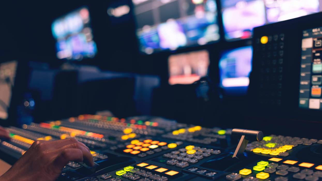A TV control room, pictured with the lights off.