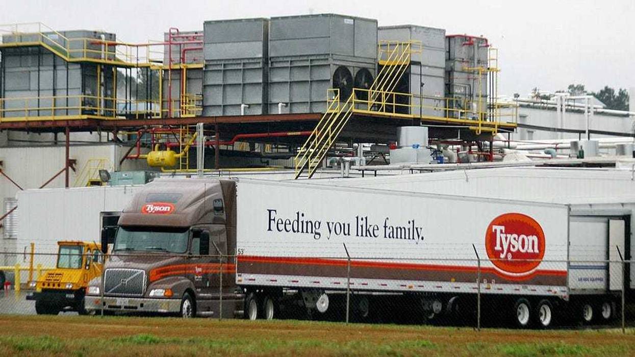 A Tyson Poultry truck backs up to its load dock at a processing plant February 25, 2004 in Carthage, Texas.
