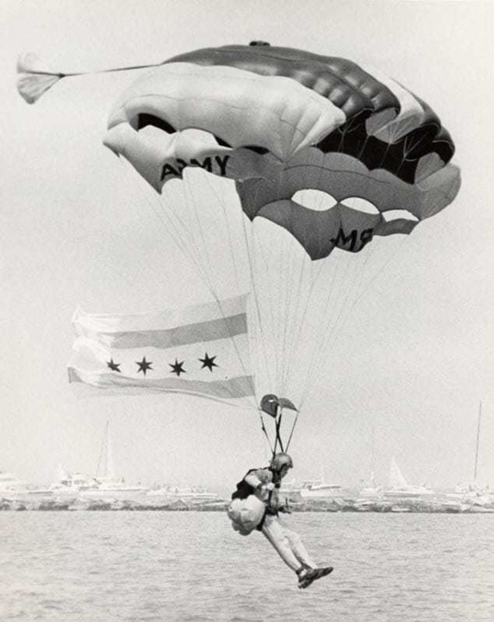 A U.S. Army Golden Knight prepares to land on the shores of Lake Michigan during the Chicago Air and Water Show.
