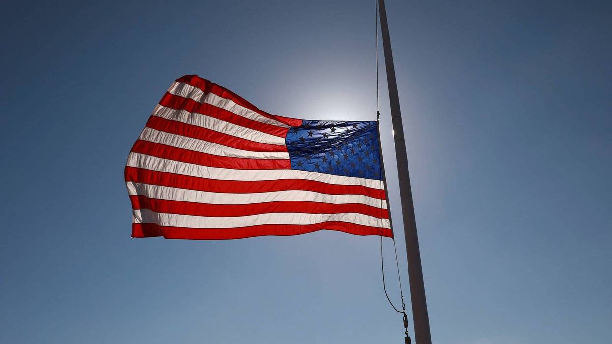 A U.S. flag flying at half-staff.