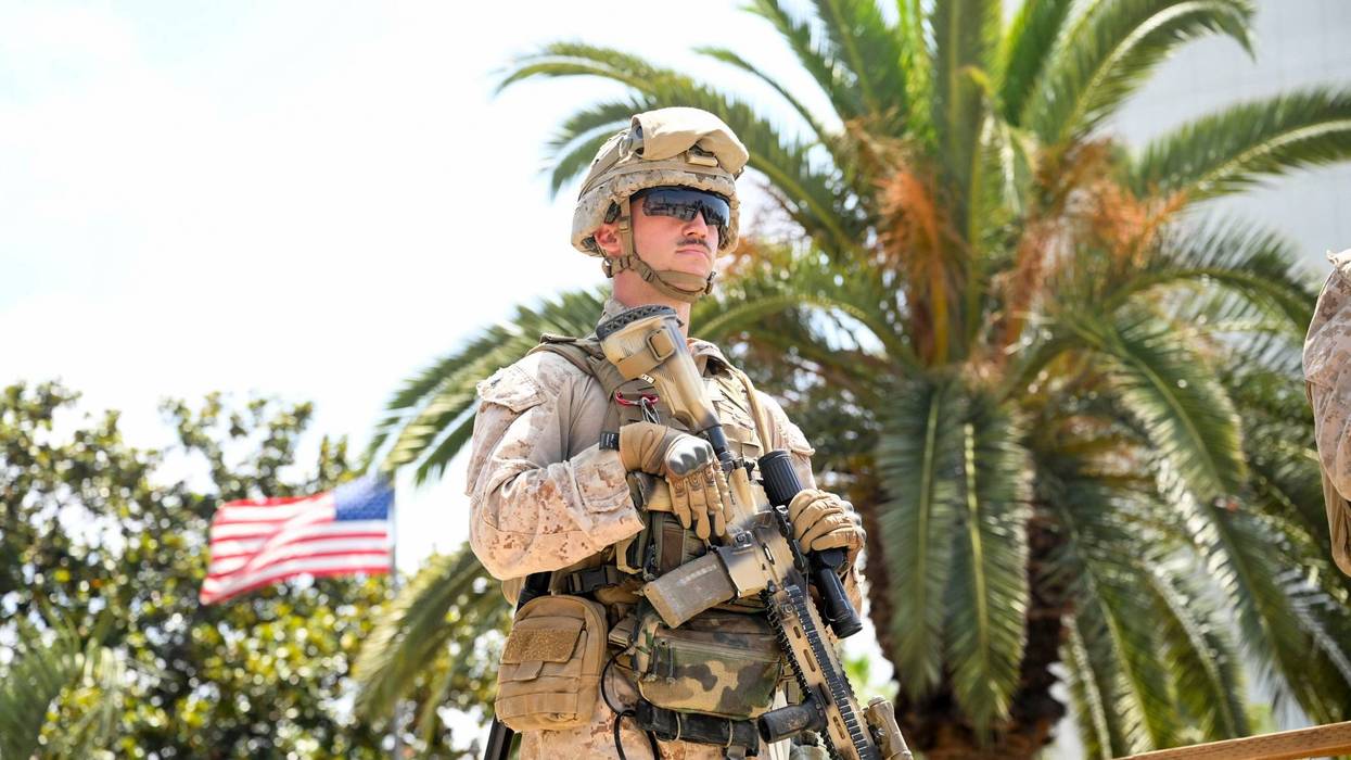 A U.S Marine guards a federal building, Friday, June 13, 2025, in Los Angeles