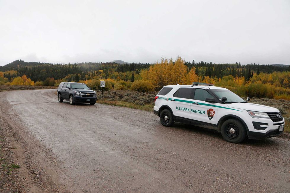 A U.S. Park Ranger vehicle drives in the Spread Creek area in the Bridger-Teton National Forest, just east of Grand Teton National Park off U.S. Highway 89, Sunday, Sept. 19, 2021, in Wyoming