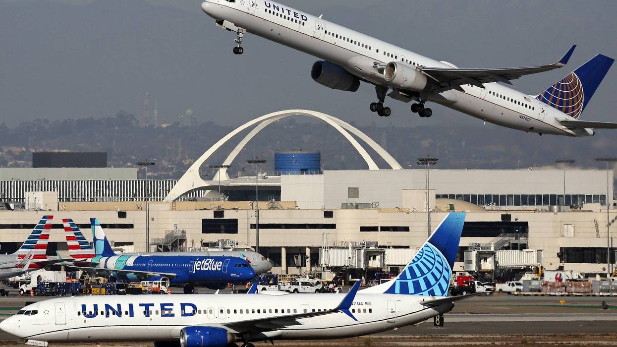 A United Airlines plane takes off as another taxis at Los Angeles International Airport (LAX) following the Thanksgiving holiday on December 2, 2024 in Los Angeles, California.
