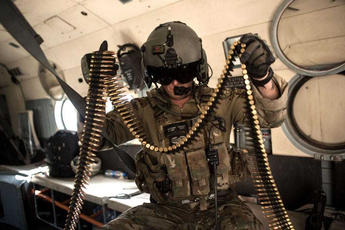 A United States Army advisor for the Afghan Air Force 777 Special Mission Wing reloads ammunition during a training mission on September 13, 2017 outside of Kabul, Afghanistan.