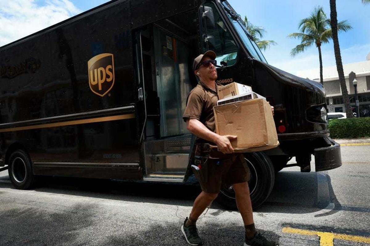 A UPS driver makes a delivery on June 30, 2023 in Miami, Florida. The union representing UPS workers announced a strike is "imminent" if the company doesn't come to the table with a significantly improved financial offer by Friday.
