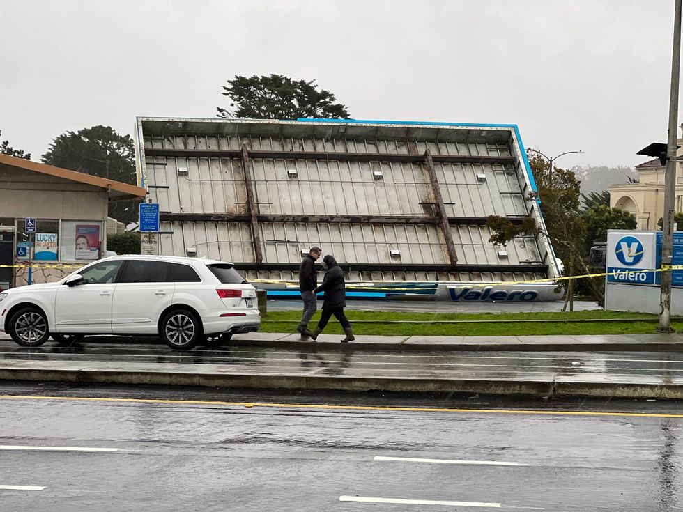 A Valero gas station in South San Francisco is closed after rain and intense winds blew the canopy over onto the gas pumps.