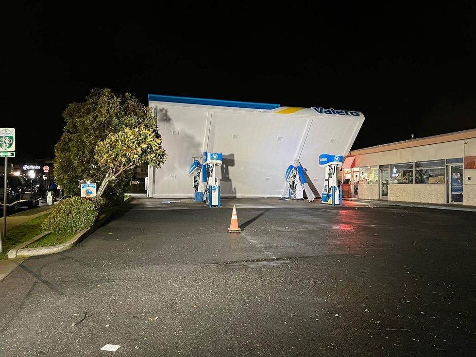 A Valero gas station in South San Francisco is closed after rain and intense winds blew the canopy over onto two gas pumps.