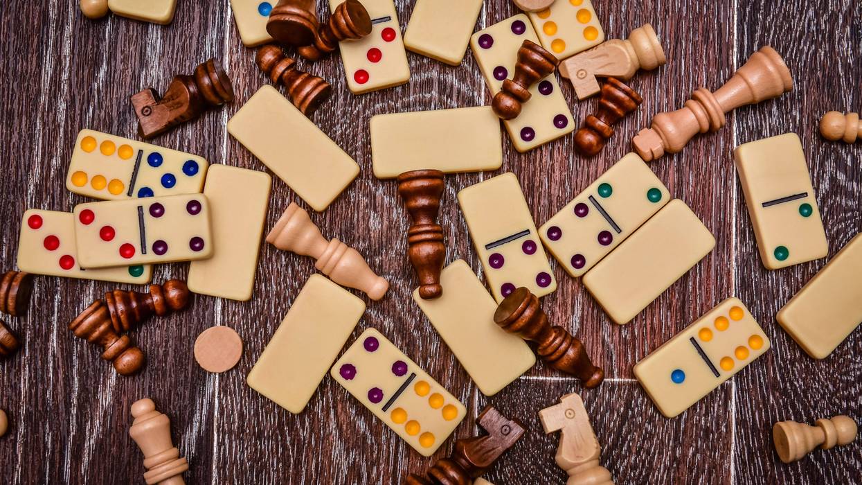 A variety of board game pieces. A background miscellaneous board game pieces.