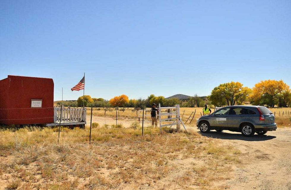 A vehicle from the Office of the Medical Investigator enters the front gate leading to the Bonanza Creek Ranch on October 22, 2021 in Santa Fe, New Mexico. Director of Photography Halyna Hutchins was killed and director Joel Souza was injured on set while filming the movie "Rust" at Bonanza Creek Ranch near Santa Fe, New Mexico on October 21, 2021. The film