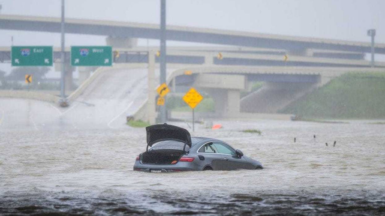 A vehicle is left abandoned in floodwater on a highway after Hurricane Beryl swept through the Houston area on July 8. Beryl developed from a tropical storm into a Category 1 hurricane as it hit the Texas coast late last night.