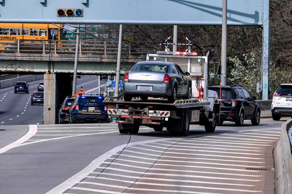 A vehicle is towed away at the Verrazzano-Narrows Bridge on April 11, 2023