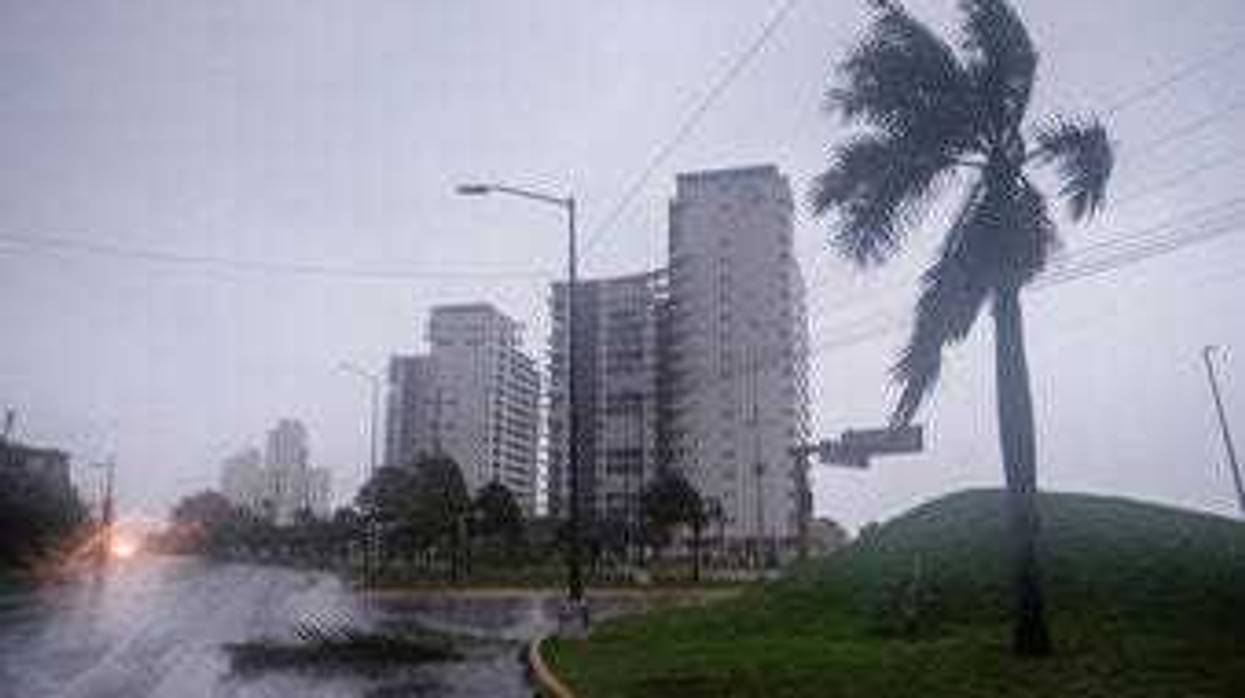 A view of a flooded street in Cancun, Mexico, Wednesday, Oct. 7, 2020. (AP Photo/Victor Ruiz Garcia)