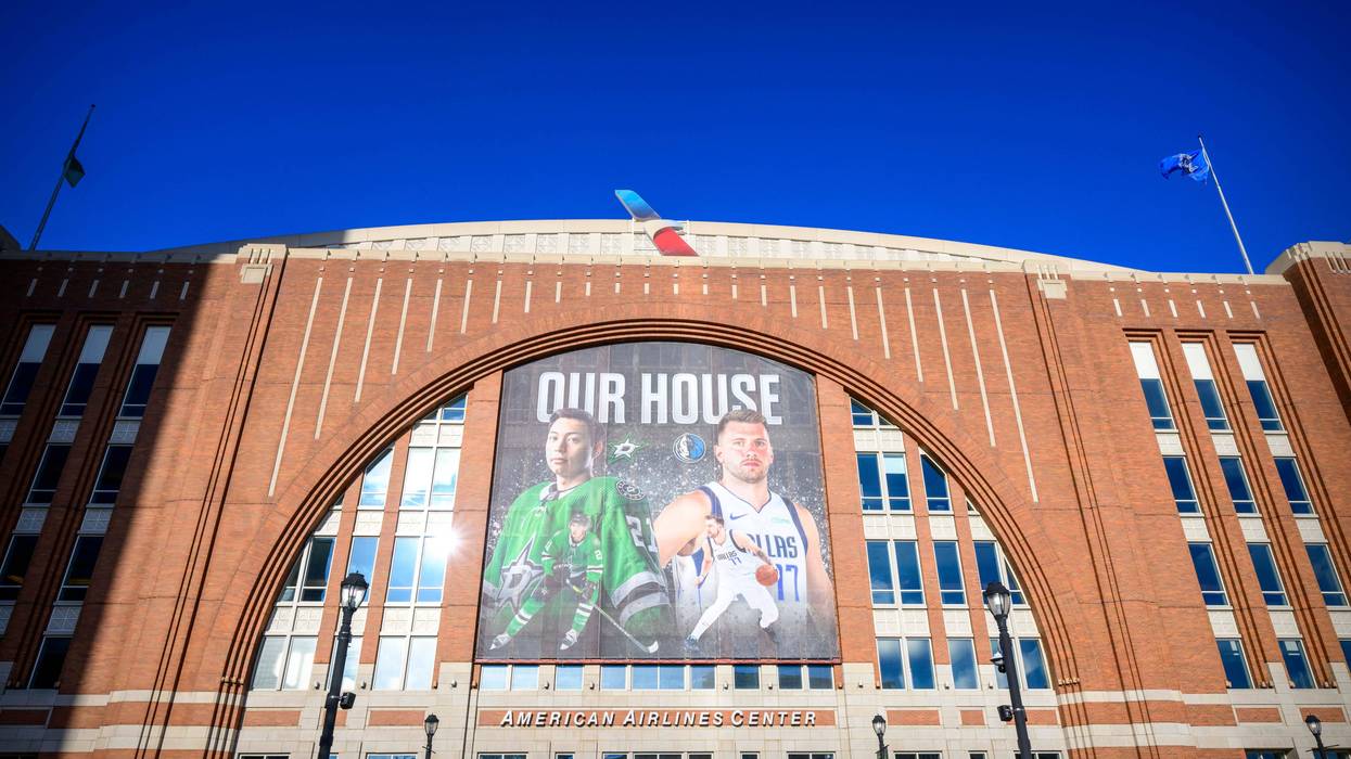 A view of an American Airlines Center exterior banner with an image of Dallas Stars left wing Jason Robertson (left) and Dallas Mavericks guard Luka Doncic (right).