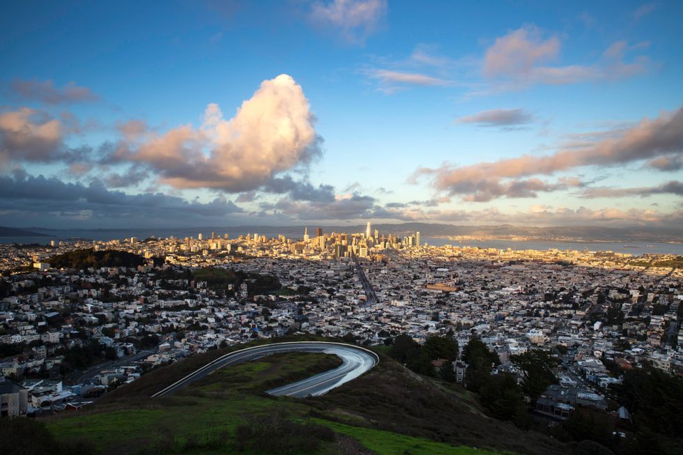 A view of San Francisco from Twin Peaks. The northern portion of Twin Peaks Boulevard is visible in the foreground.