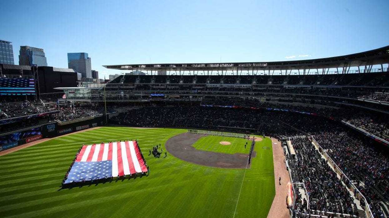A view of Target Field during the national anthem before the start of the game between the Seattle Mariners and Minnesota Twins on Opening Day at Target Field on April 8, 2022 in Minneapolis, Minnesota.