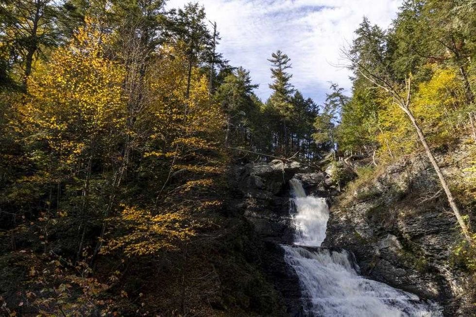 A view of the Raymondskill Falls at the Delaware Water Gap in Milford, Pa., on Friday, Oct. 15, 2021. Up a winding mountain road two hours from any major city, cars from Pennsylvania, New Jersey, and New York wedge into parking spots to see Raymondskill Falls, Pennsylvania