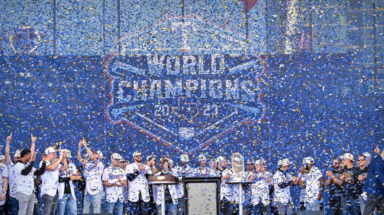 A view of the Texas Rangers team as the confetti flies during the celebration outside of the ballpark after the World Series championship parade at Globe Life Field.