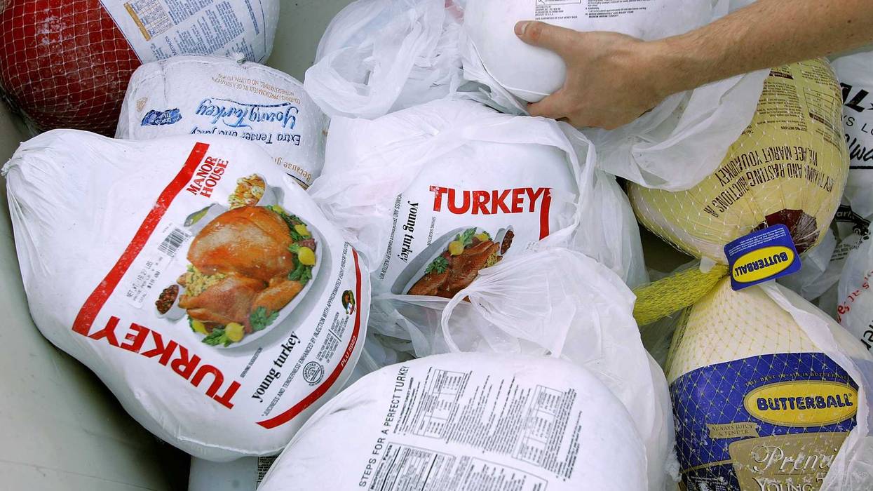 A volunteer prepares a box of turkeys to be given out during the 2006 holiday turkey distribution at the San Francisco Food Bank November 21, 2006 in San Francisco, California.