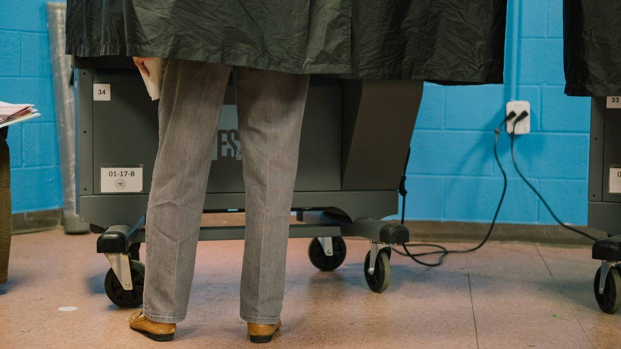 A voter casts a ballot at a polling location in Philadelphia on May 17, 2022.