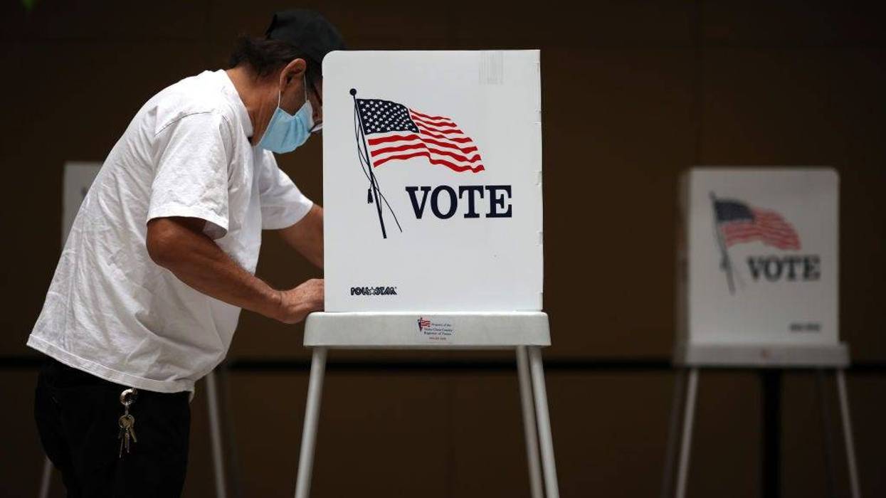A voter fills out his ballot while early voting on October 13, 2020 in San Jose, California.