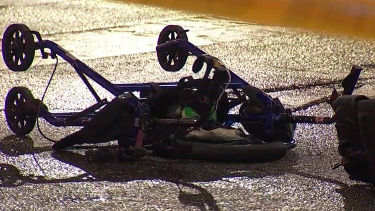 A walker lying in the street after a hit-and-run
