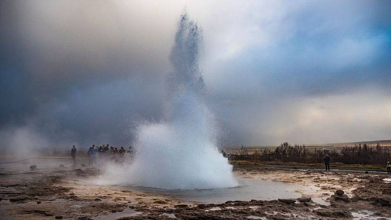 A Washington woman has been hospitalized after jumping into a hot spring in Yellowstone National Park.