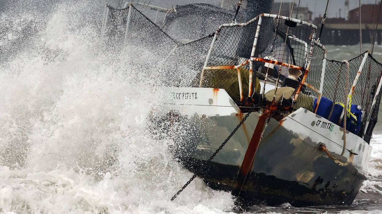 A wave hits a boat which washed ashore as a powerful long-duration atmospheric river storm, the second in less than a week, impacts California on February 4, 2024 in Santa Barbara, California. The storm is delivering potential for widespread flooding, landslides and power outages while dropping heavy rain and snow across the region.