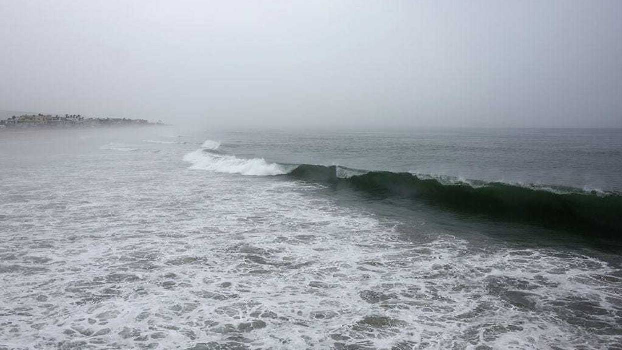 A waves breaks on the Pacific Ocean with Tropical Storm Hilary approaching in San Diego County on August 20, 2023 in Imperial Beach, California.