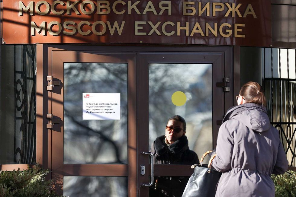A woman at the Moscow Exchange office in Bolshoy Kislovsky Pereulok Street. The Bank of Russia has decided to resume federal loan bonds trading on the Moscow Exchange.