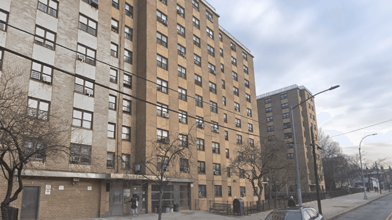 A woman attacked a man with a hammer at an apartment tower on Linden Place in Flushing on Monday night