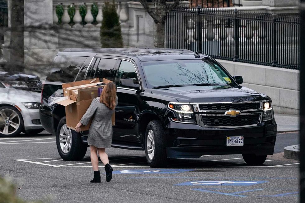 A woman carries boxes out of the West Wing of the White House on January 15, 2021 in Washington, DC. According to recent news reports, President Donald Trump is slated to leave Washington the morning of Jan. 20th, hours before President-elect Joe Biden will be sworn-in as president.