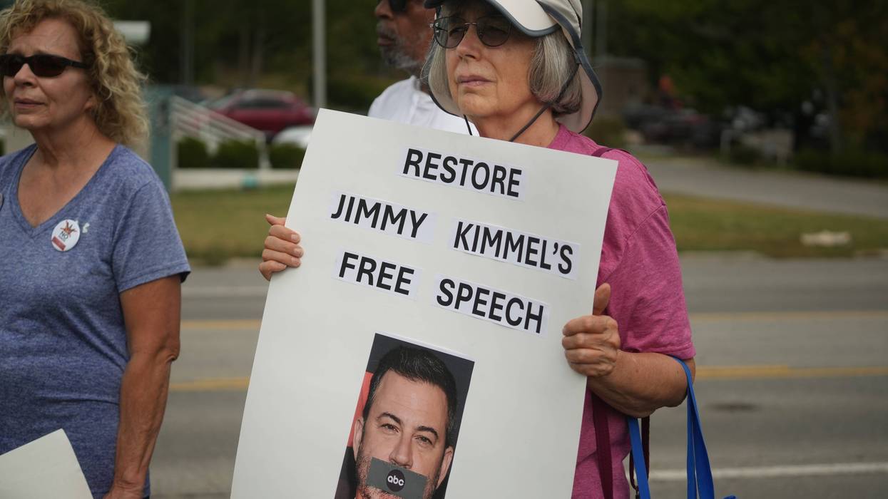 A woman holds a sign supporting Jimmy Kimmel Sept. 23 as the local justice and human rights advocacy group Indivisible Central Ohio held a protest outside Columbus' ABC affiliate station WSYX ABC 6 & WTTE FOX 28 in protest of the company's Sept. 17 suspension of Jimmy Kimmel's late-night show.