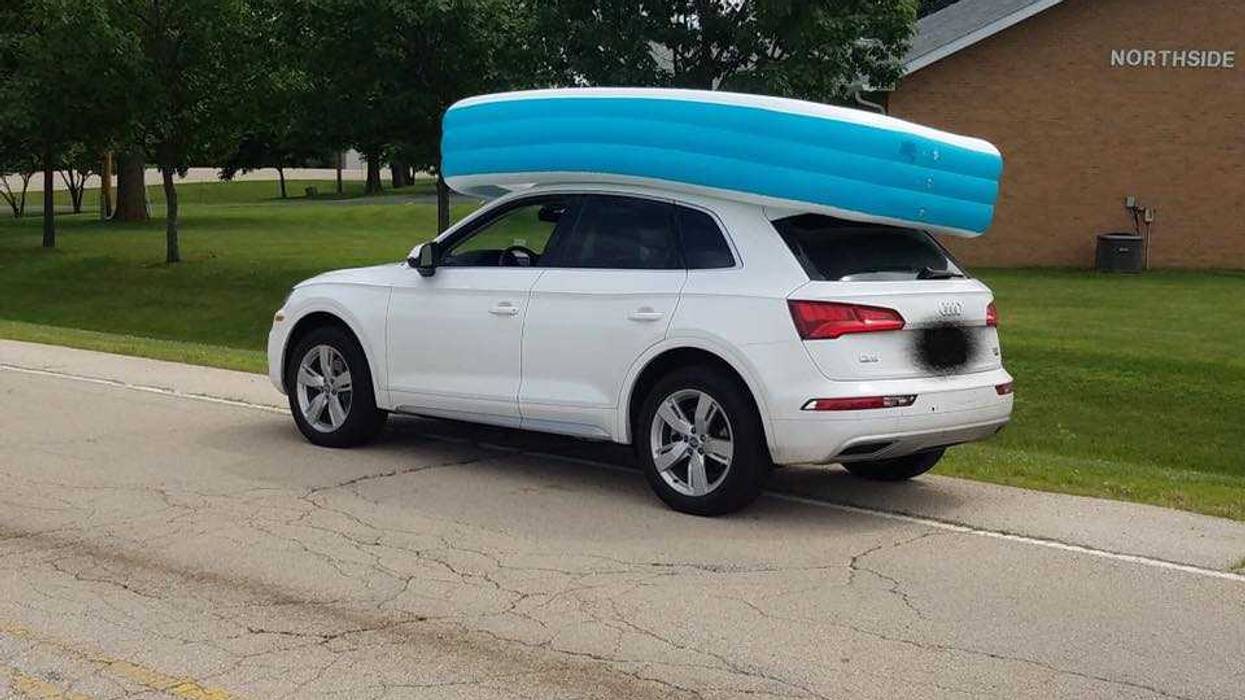 A woman is charged with child endangerment after transporting a pool with children in it atop of her vehicle.