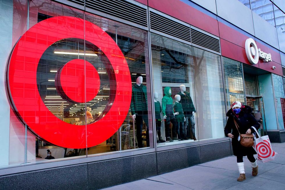 A woman leaves Target store on March 02, 2021 in New York. Target hopes to build a growth by investing about $ 4 billion annually for the next years to accelerate the consolidation of new stores, upgrade existing ones and enhance its capacity to fulfill online orders.