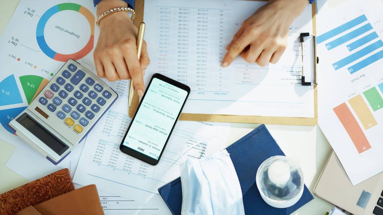 A woman looking at financial figures.