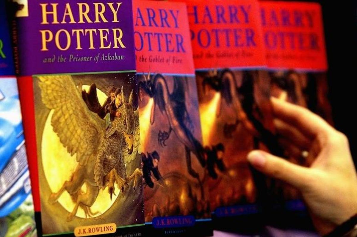 A woman looks at some of J.K Rowlings Harry Potter books in waterstones book store on June 16, 2003 in London.