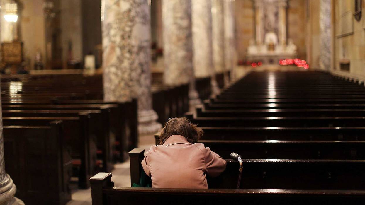 A woman prays in a Catholic church on May 20, 2013 in Waterbury, Connecticut.