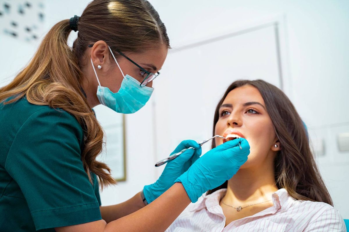 A woman receiving dental care.
