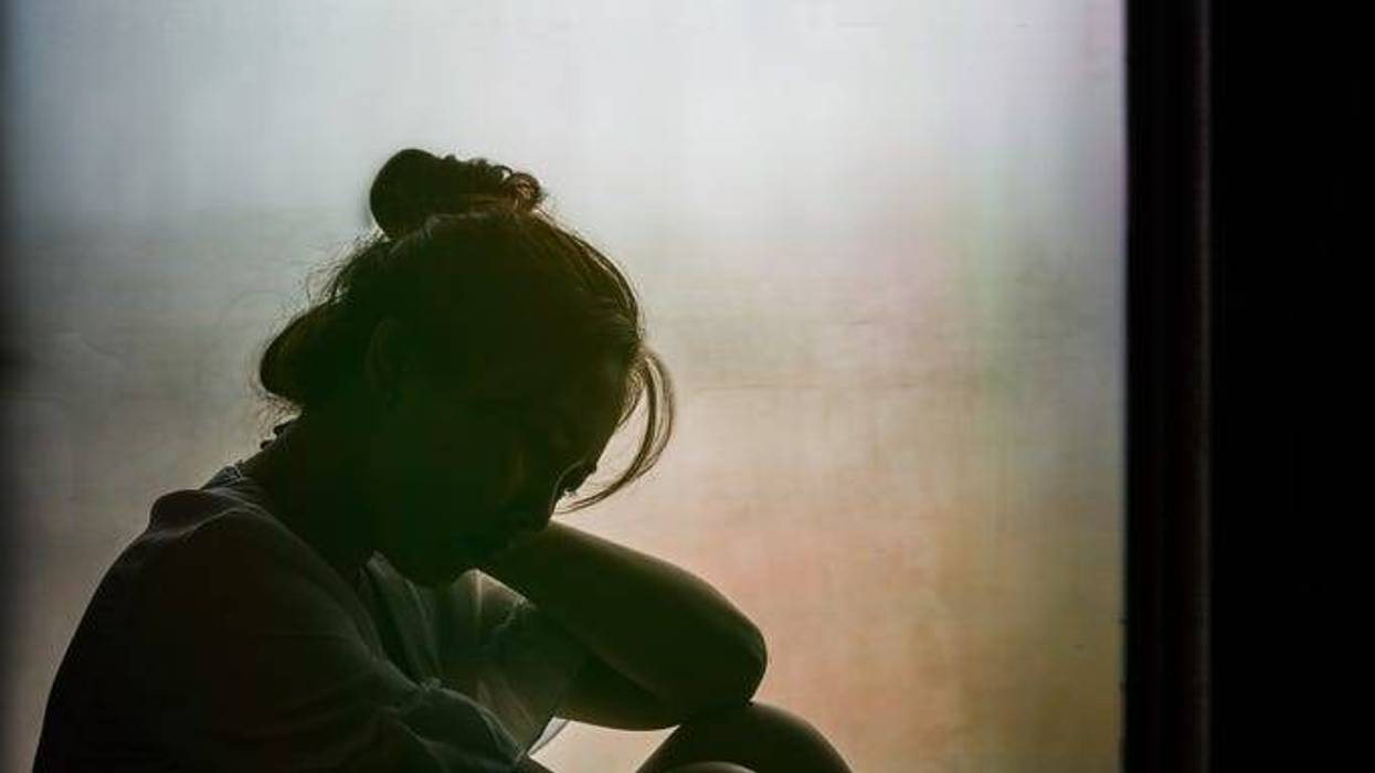 A woman sitting alone