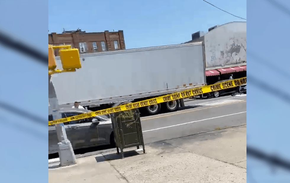 A woman struck a car door and was thrown into the path of a semi-truck during the crash, police said