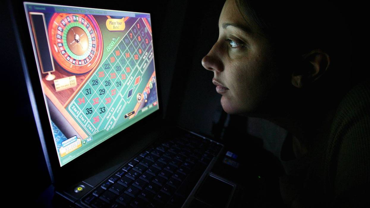 A woman using an internet gambling website to play online roulette.