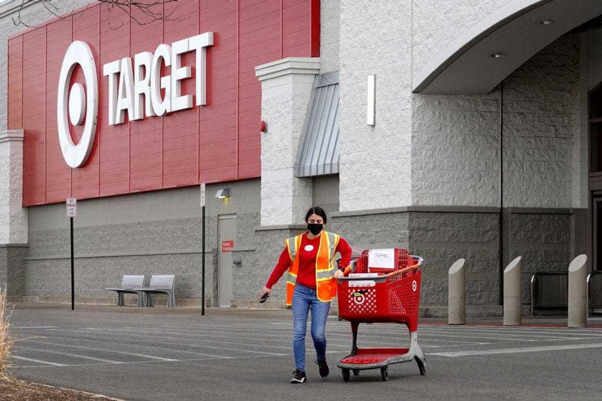 A worker brings merchandise to a customer who opted for pick-up service at a Target store on January 13, 2021 in Chicago, Illinois.