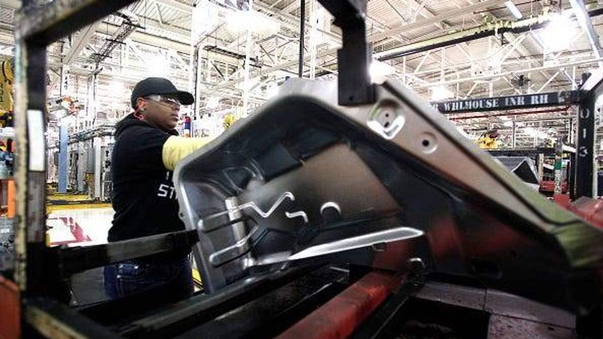 A worker is shown at the Warren Stamping Plant January 22, 2016 in Warren, Michigan.