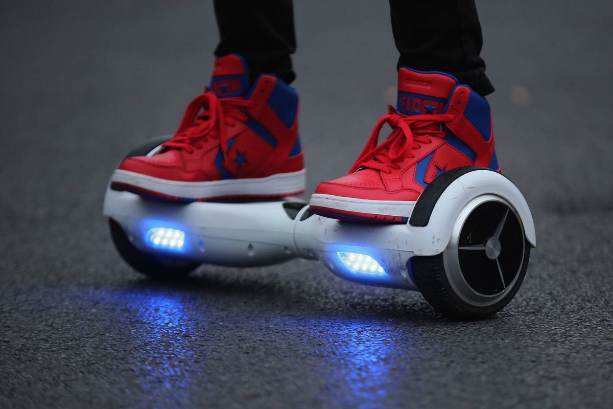 A young person on a hoverboard.