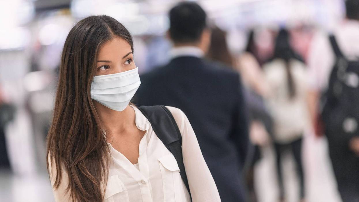 A young woman traveling during the pandemic.
