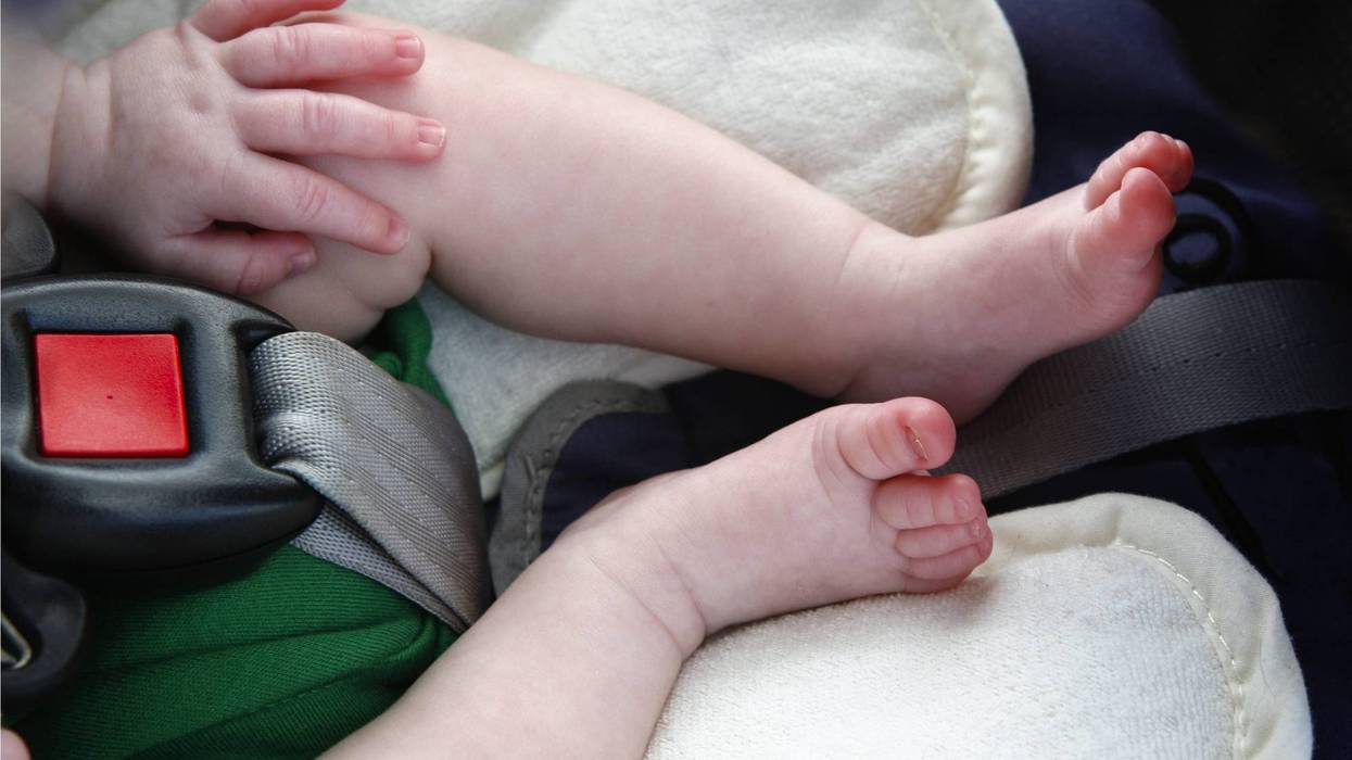 A young woman was arrested over the weekend after authorities found two young children -- including a newborn -- left in car sets behind a dumpster in Madison Heights.