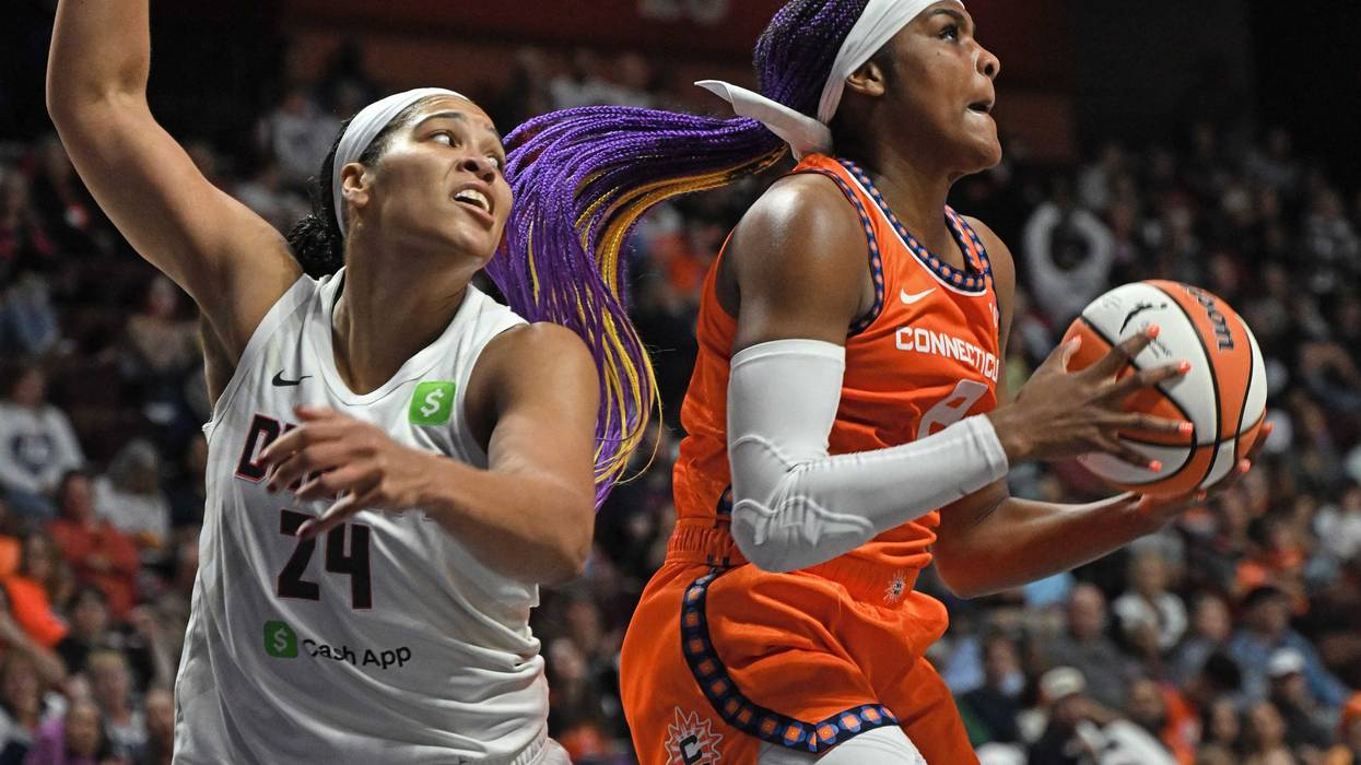 Aaliyah Edwards #8 of the Connecticut Sun takes the rebound from Brionna Jones #24 of the Atlanta Dream in the first half at Mohegan Sun Arena on September 10, 2025 in Uncasville, Connecticut.