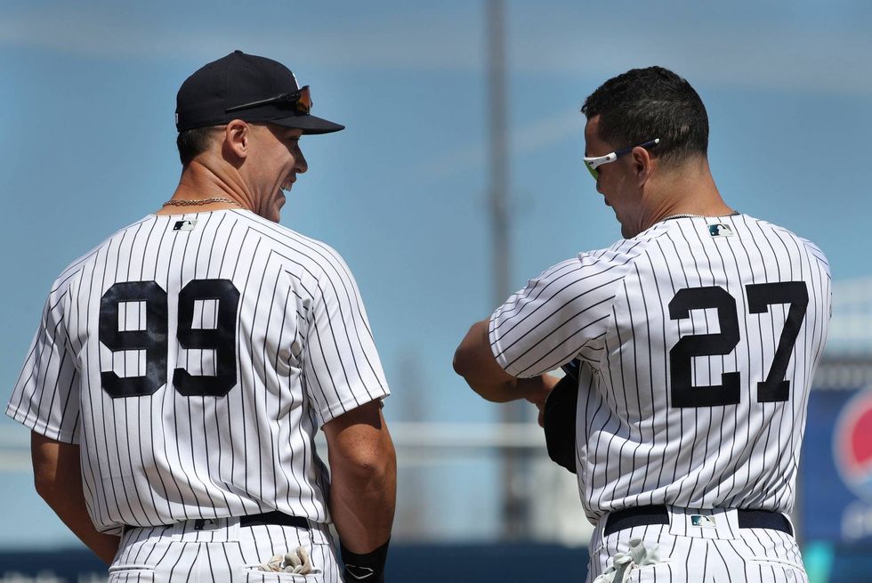Aaron Judge and Giancarlo Stanton before a spring training game.