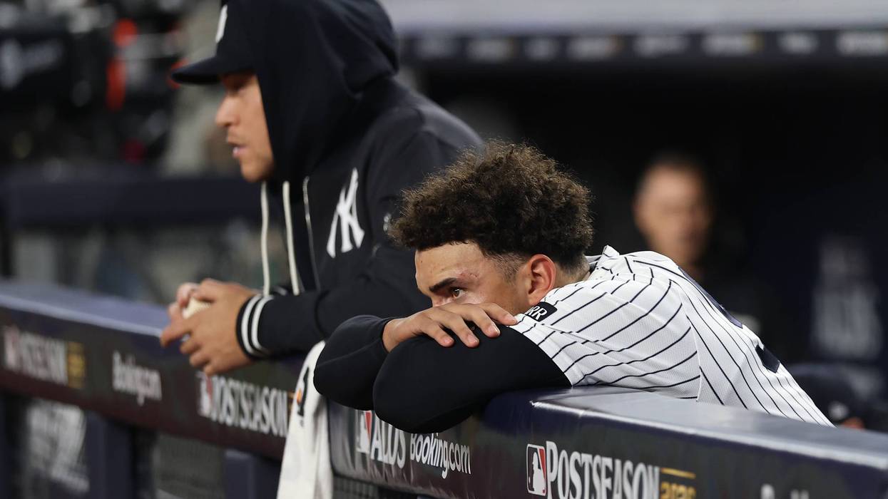 Aaron Judge, left, and George Lombard Jr. watch the Rays celebrate